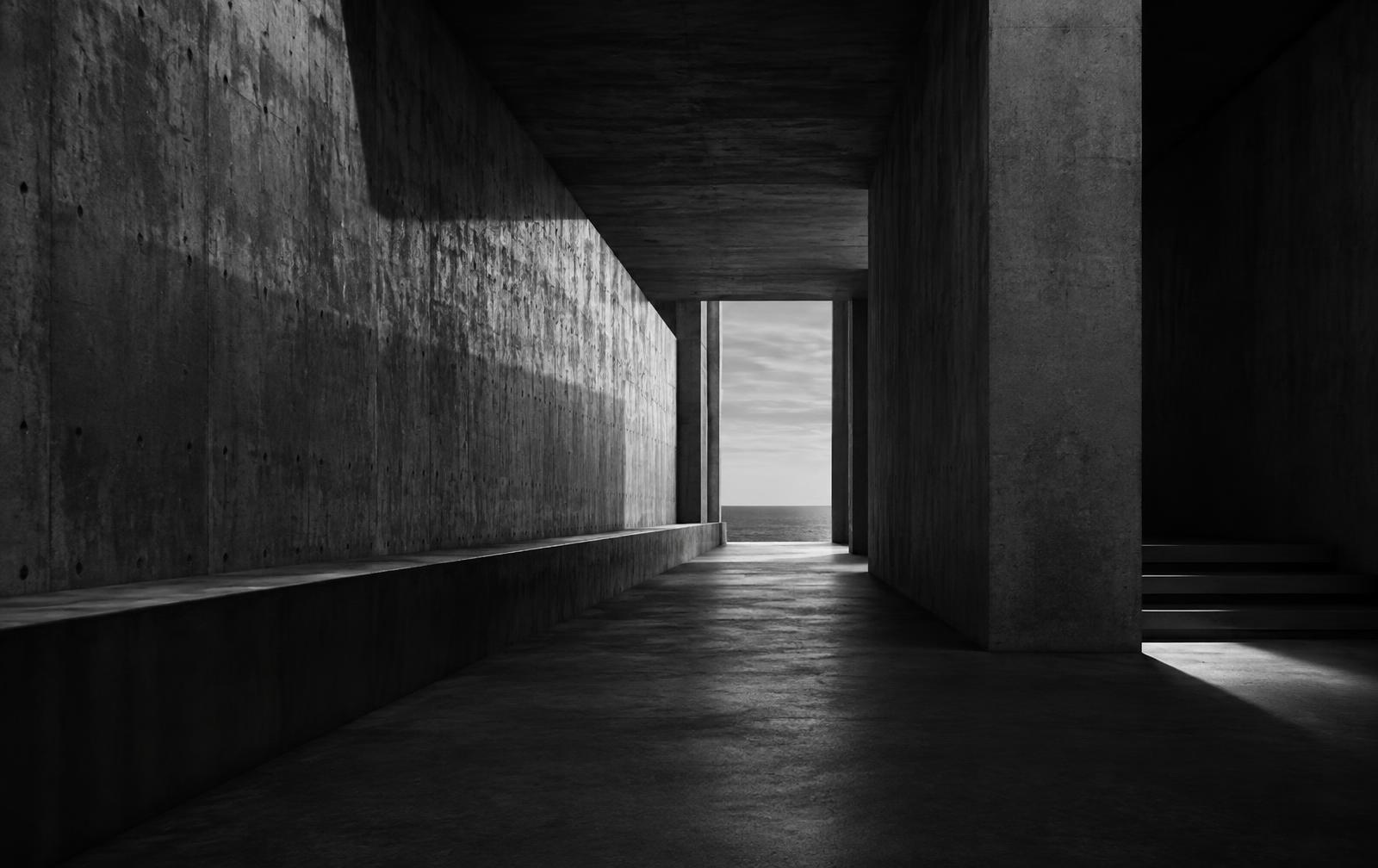 A concrete passage opening toward the horizon